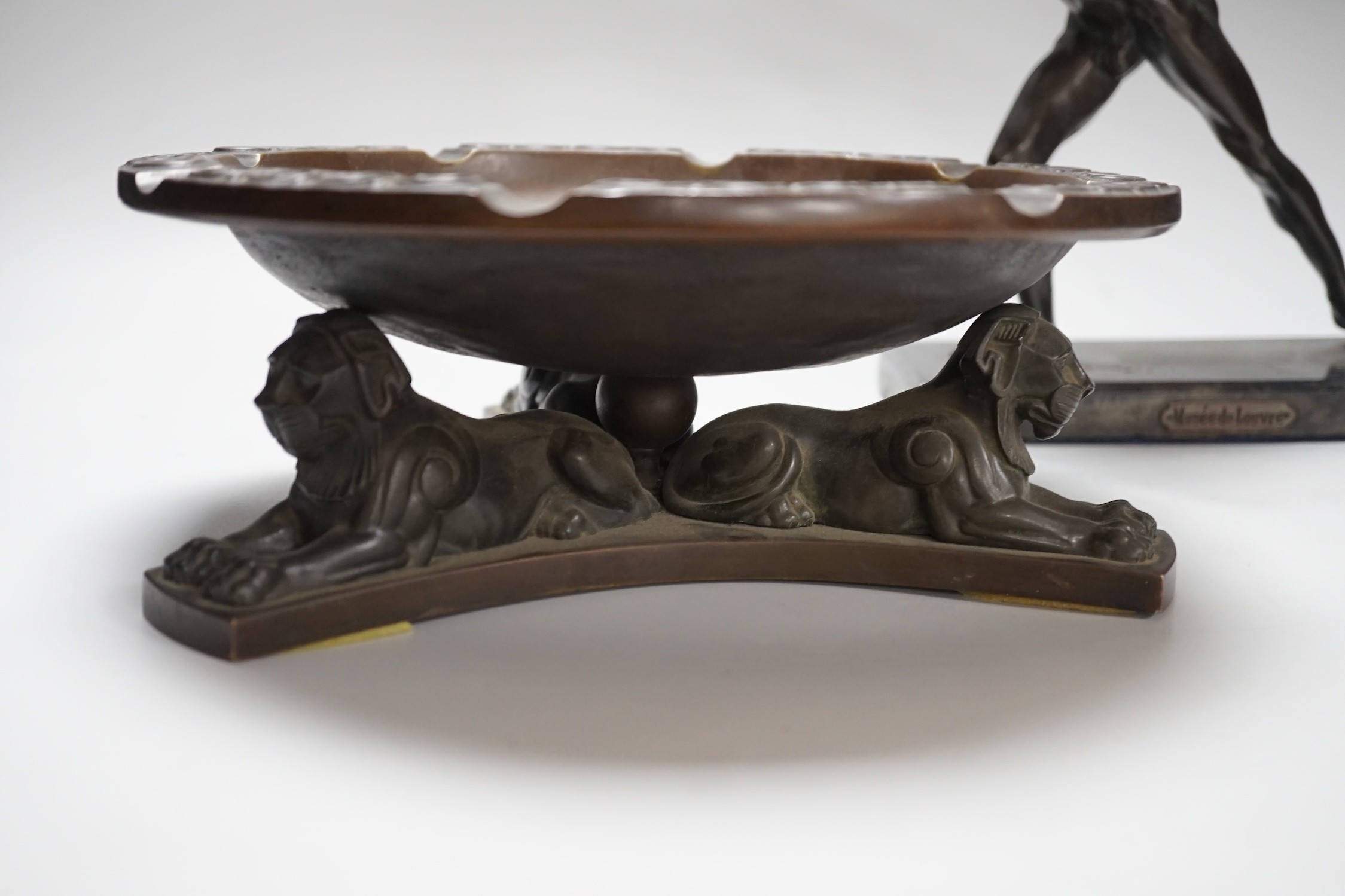 A large bronze dish, on triform lion base, and a bronze-finished warrior, dish 28cms diameter